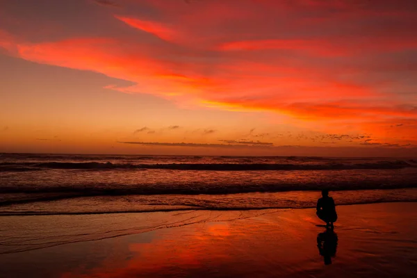 Young man sitting outdoors watching the sunset. Thinking and relaxing concept, Australia — Stock Photo, Image