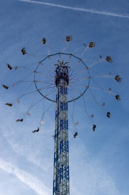Munich, Germany - 2019, September 19: people on a tallest kettenkarussell at the biggest folk festival in the world - the octoberfest