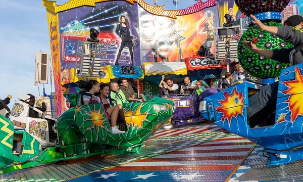 Munich, Germany, 2019 September 28: Visitors enjoy on an Amusement Park Ride. Breakdancer fun Ride, Oktoberfest Munich Bavaria Germany — Stock Photo, Image