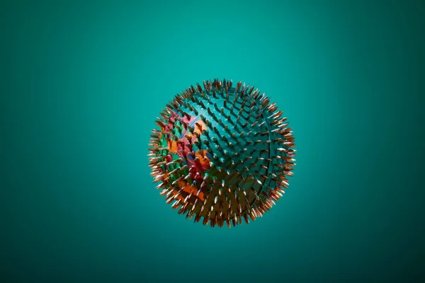 A green barbed massage ball hangs in the air, with beautiful lighting on a green background. color of the ocean. side view. healthy lifestyle. Thematic and promotional photography. For relaxation and health.
