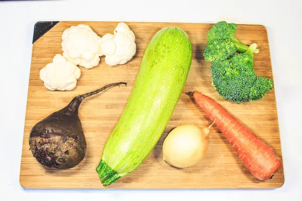 Fresh Vegetables Lie Wooden Board Courgettes Carrots Brocali — Stock Photo, Image