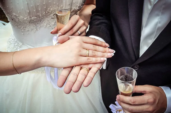 Hands newlywed with gold rings on his right hand