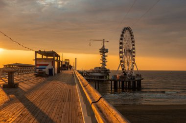 Beautiful sunset at the Pier, Scheveningen, Hague, Netherlands clipart