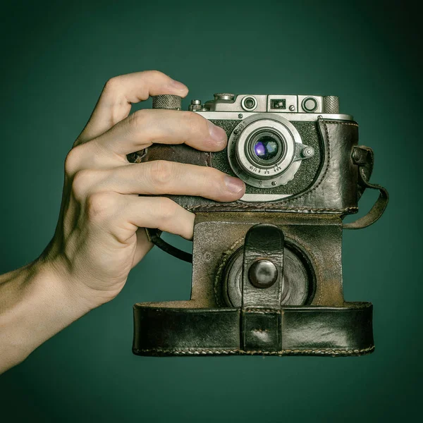 Hand with vintage camera