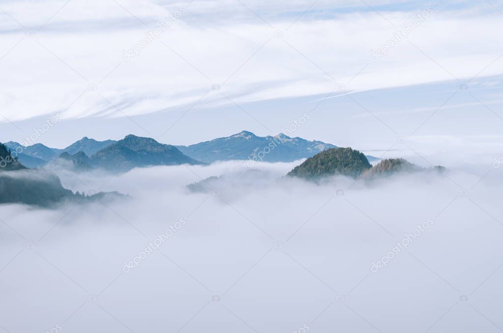 Peaks of mountains above the cloud.