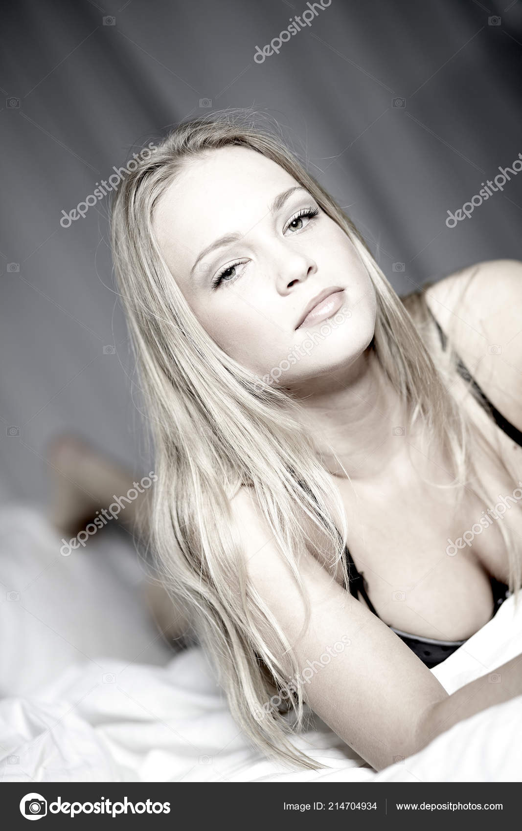 Premium Photo  Blond woman in underwear lying on bed