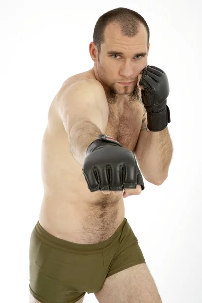 白いスタジオの背景に隔離された姿勢でボクシンググローブの悲観的な選手 — ストック写真