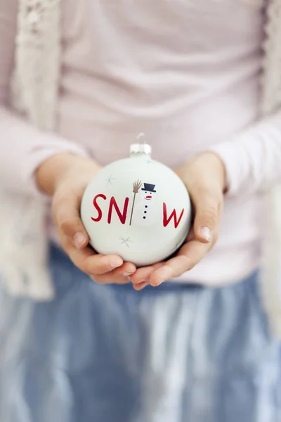 Little Girl Holding Beautiful Christmas Bauble Snowman Hands Close — Stock Photo, Image