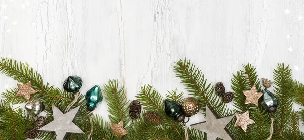Green Christmas Tree Branches Baubles Pine Cones White Wooden Background — Stock Photo, Image