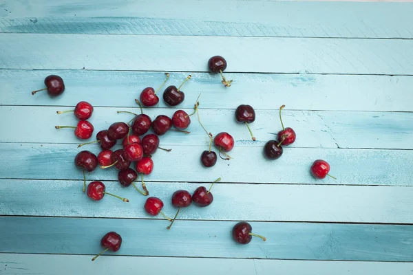 Pile Red Ripe Cherries Turquoise Wooden Background — Stock Photo, Image