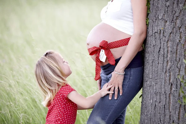 Pregnant Woman Ribbon Belly Standing Little Daughter Tree — Stock Photo, Image