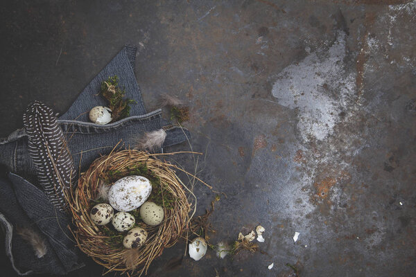 Easter decoration with nest and eggs on dark background, holiday concept  