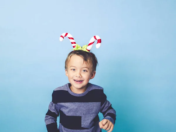 Little Boy Christmas Decoration Head Posing Front Blue Studio Background — Stock Photo, Image