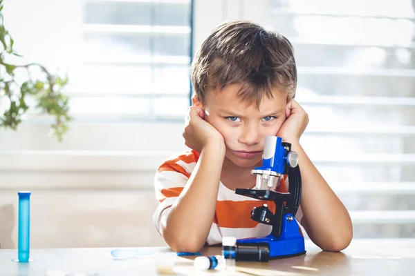 Little Boy Frustrated While Working Microscope Home — Stock Photo, Image