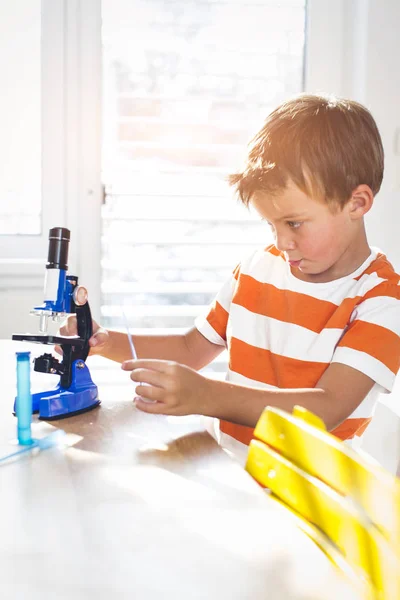 Cute Boy Working Microscope Examines Chemistry Reagents — Stock Photo, Image