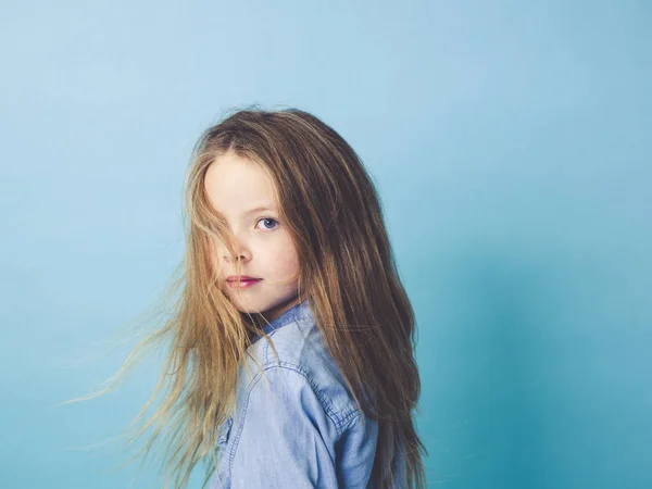 Beautiful Little Girl Waving Hair Posing Front Blue Studio Background — Stock Photo, Image