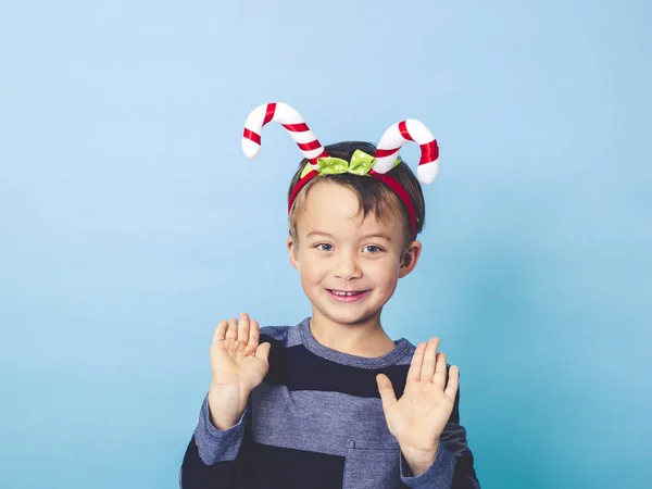 Little Boy Christmas Decoration Head Posing Front Blue Studio Background — Stock Photo, Image