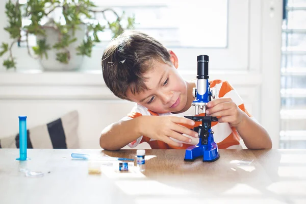 Cute Boy Working Microscope Examines Chemistry Reagents — Stock Photo, Image