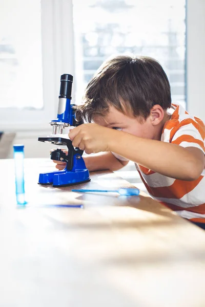 Cute Boy Working Microscope Examines Chemistry Reagents — Stock Photo, Image