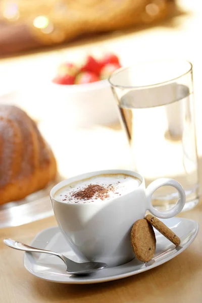 coffee cup with pie and glass of water on background, close-up