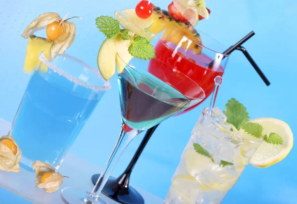 collection of cocktails with fruit decoration in glasses, close-up