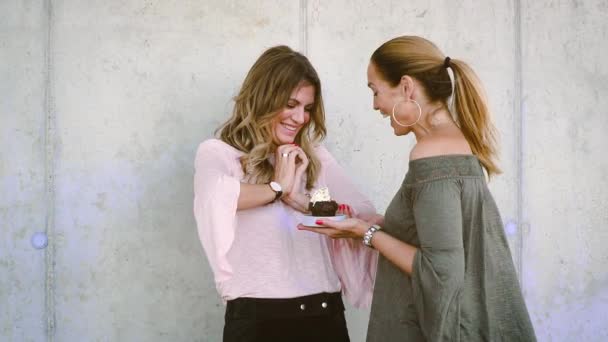 Two Beautiful Woman Enjoying Together While Pouring Colorful Sugar Sprinkles — Stock Video