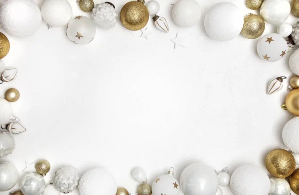 Christmas Greeting card with golden and white baubles , close-up