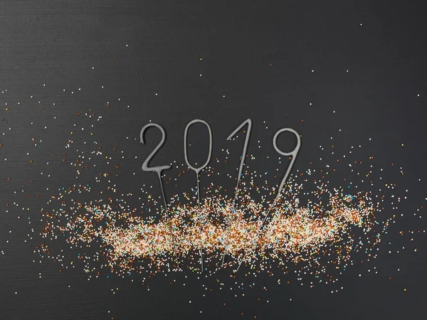 New Year background with lettering 2019 and colorful balls on grey background