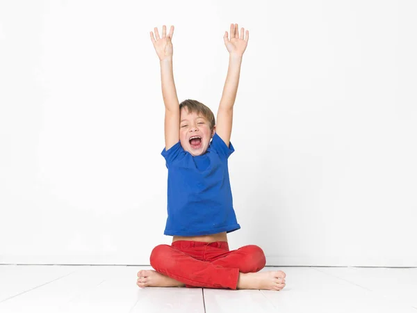 Six Year Old Boy Red Trousers Blue Shirt Shouting Sitting — Stock Photo, Image