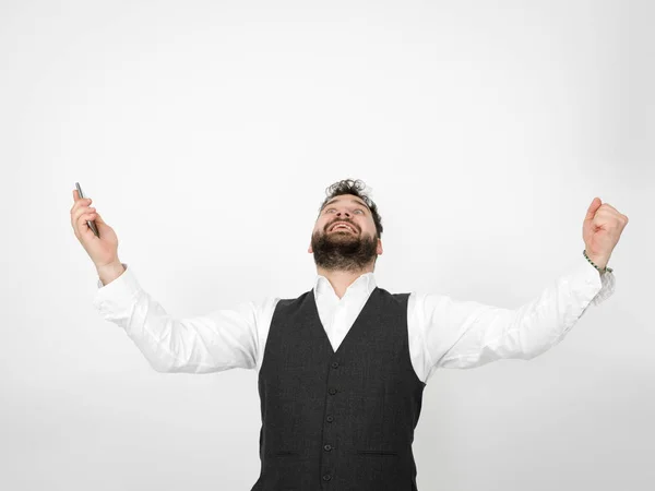 Young Man Black Beard Holding Smartphone Standing Raised Arms While — Stock Photo, Image