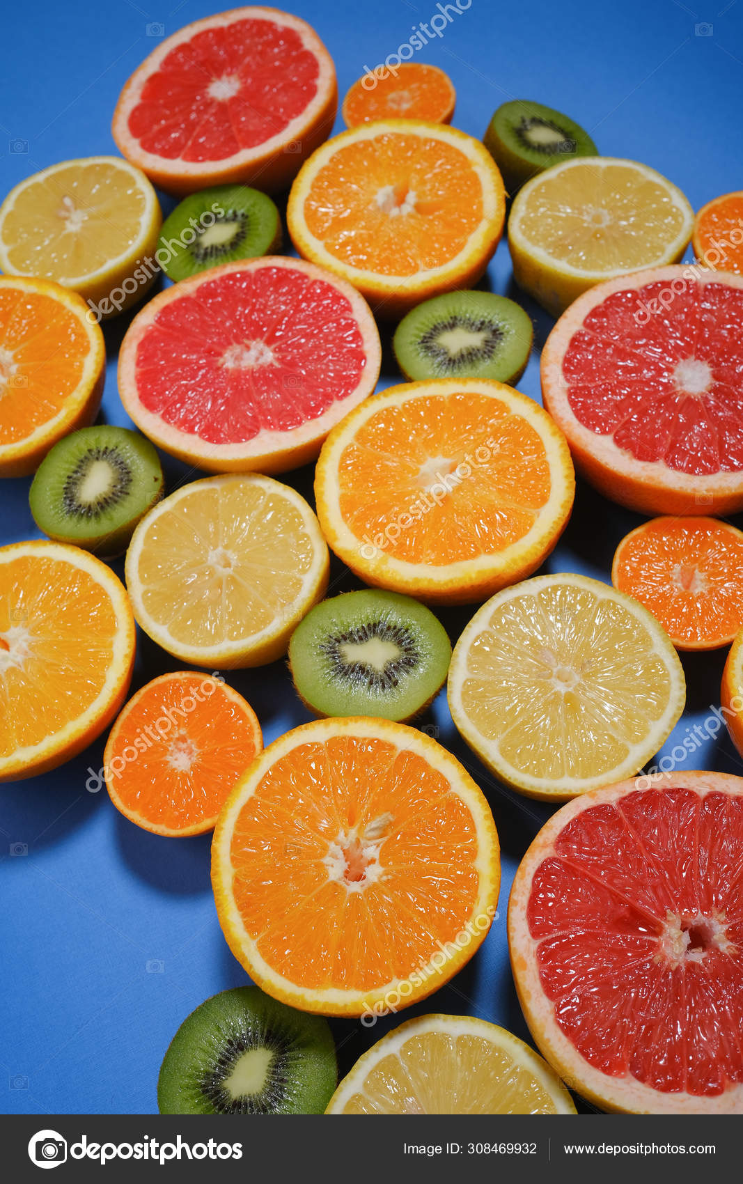 Assortment Various Cut Raw Fruits Blue Background Full Frame Stock
