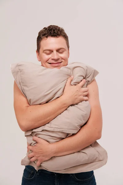 Studio Portrait Sleepy Man Hugging Pillow Plain Background — Stock Photo, Image