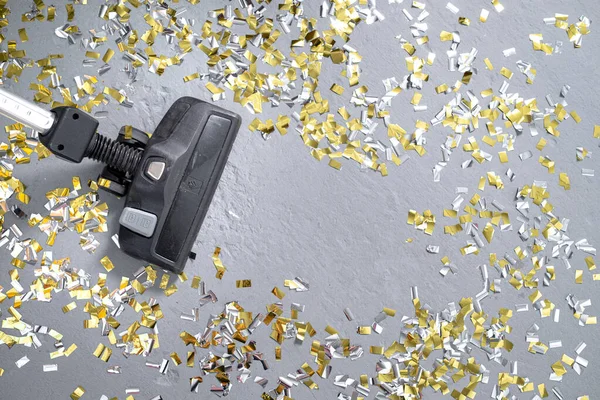 vacuum cleaner cleaning glittering confetti