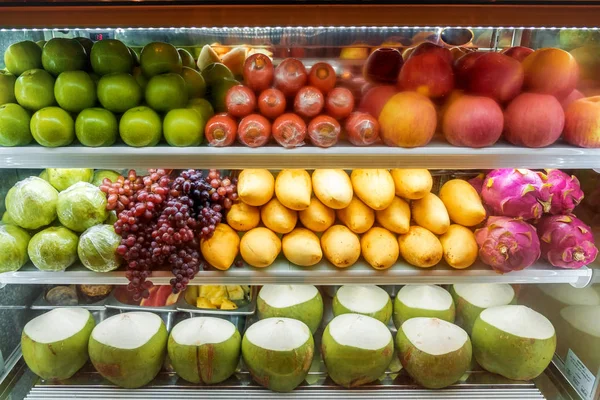 Variety of fresh fruit for sale in the supermarket refrigerator. Bangkok, Thailand.
