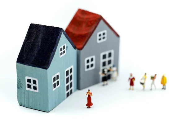 Miniature people : wife and friend with house using concpet for Housewifes Day