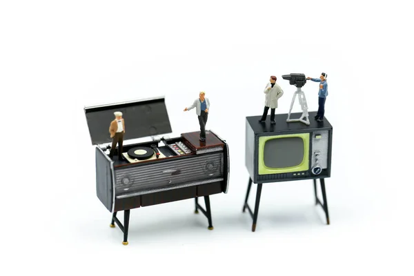 Miniature people : the small team of tv reporter of Audio Speakers, production television concept.