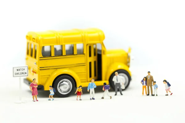 Miniature people : Children,students going to school with school bus,back to school, education concept