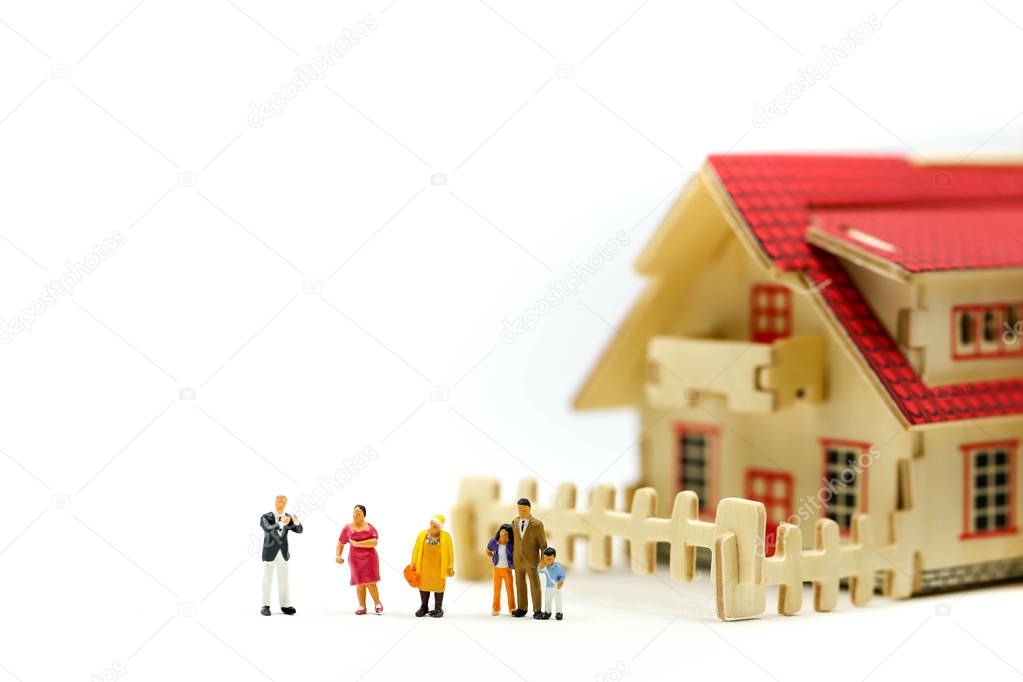 Miniature people : meet with realtor or broker talking about home purchase,taking loan for first apartment, family counselling.