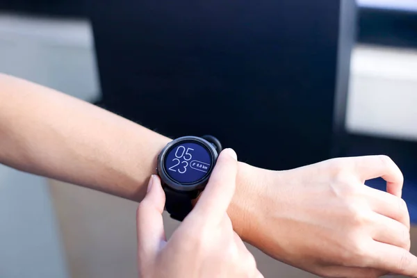 Use of fitness smart watch to monitor her performance.