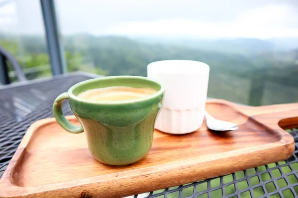 Cup of coffee and tea in the beautiful sky of mountains,travelin