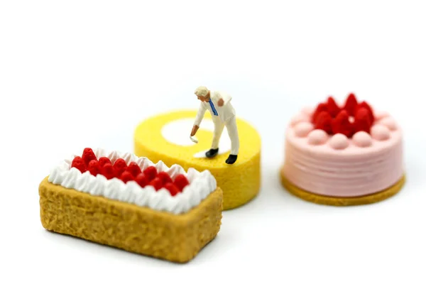 Miniature people : Worker painting with Sweet dessert,cooking an