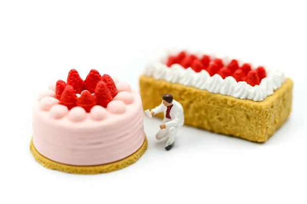 Miniature people : Worker painting with Sweet dessert,cooking an