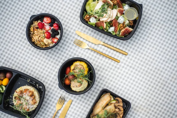 Sat of take away boxes with healthy food on the table. Restaurant dishes. Flat lay