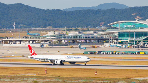 INCHEON, SOUTH KOREA - August 17 2018 - Incheon Airport, Seoul, South Korea, Asia. Passenger terminal 2 with Aircraft. KoreanAir Airplane. Multiple airplanes.  .turkishairlines Aircraft.