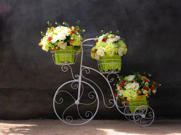 Artificial flowers and Artificial tricycle, rered white green and yelow flowers