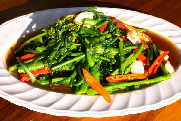 Fried Cantonese lettuce, Chinese food style, Asian Chinese Cooking Style Stir Fry Vegetable.