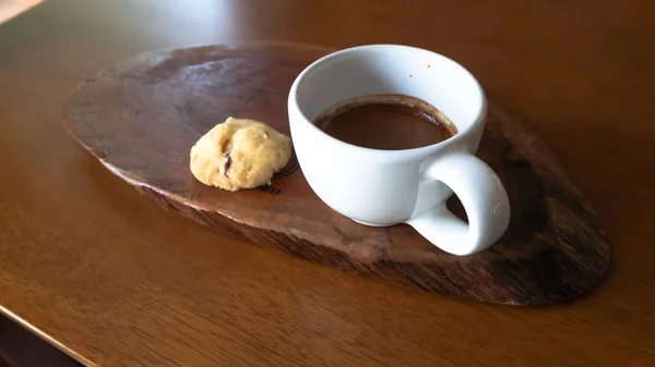 Coffee Espresso. Coffee Espresso. Cup Of Coffee, Cup of coffee with cookie on wood table.