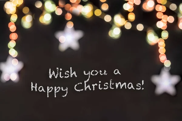 metin dilek sen a mutlu Noel bulanık renkli yıldız ve ışık ile siyah arka plan