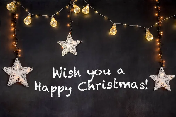 Metin dilek sen a mutlu Noel yıldız ve ışık ile siyah arka plan.