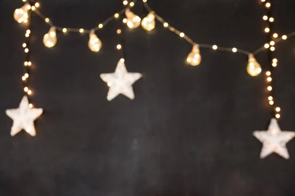 siyah arka plan bulanık sarı yıldız ve bir kartpostal için ışıkları ile